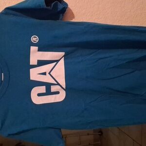 A teal catapillar shirt